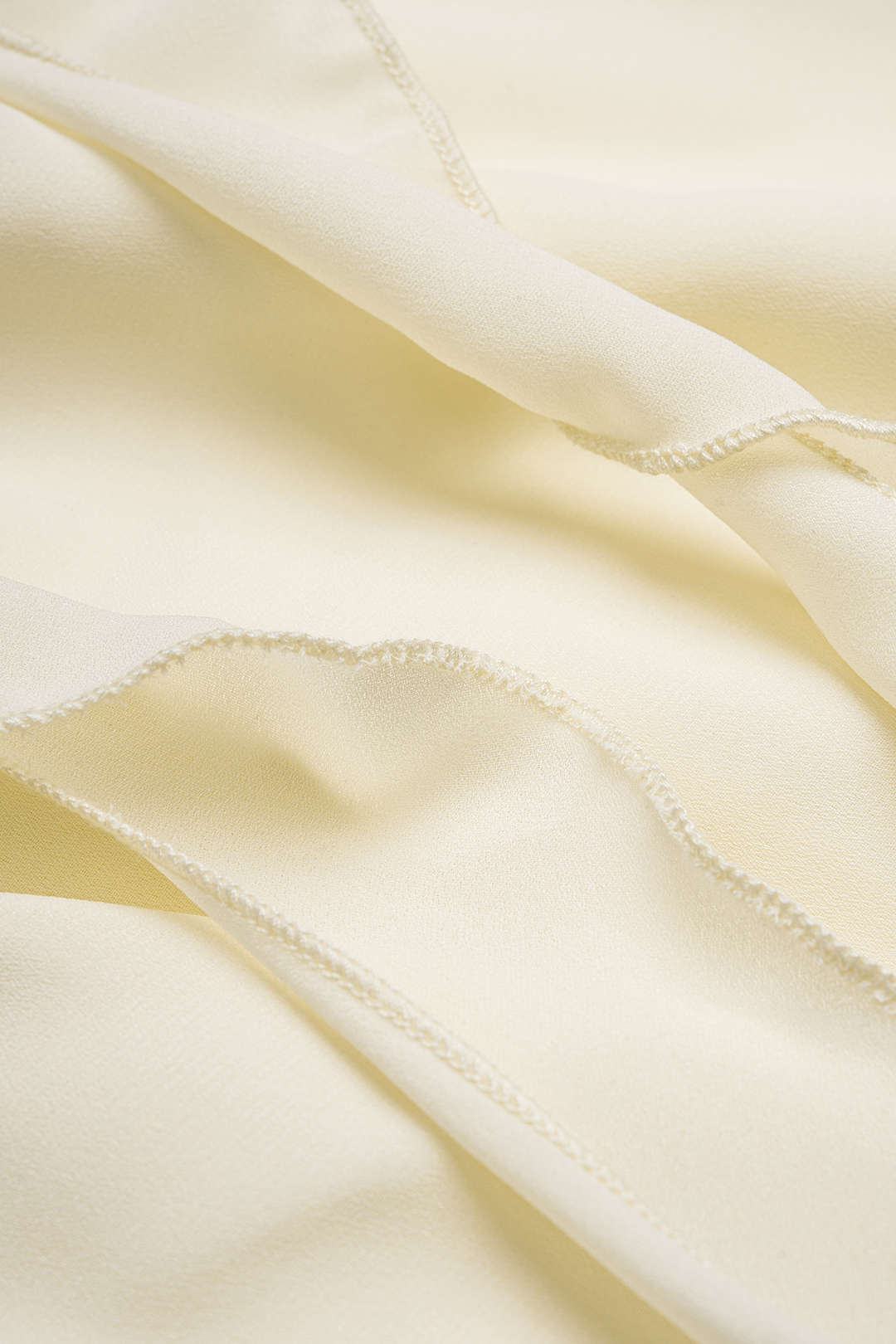 Chiffon tanktop met halternek, volants en open rug