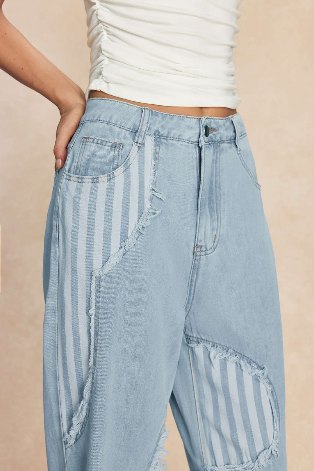 Patchwork jeans met rafelrand en wijde pijpen