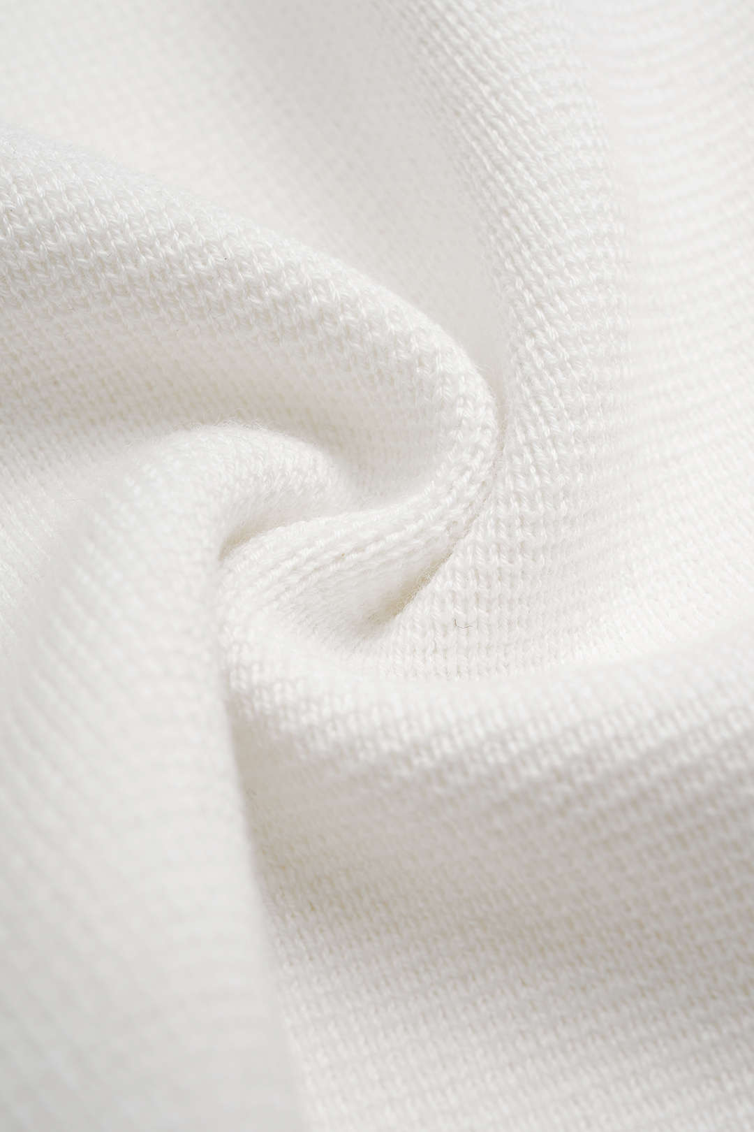 Gebreide metallic top met knoopjes en lange mouwen