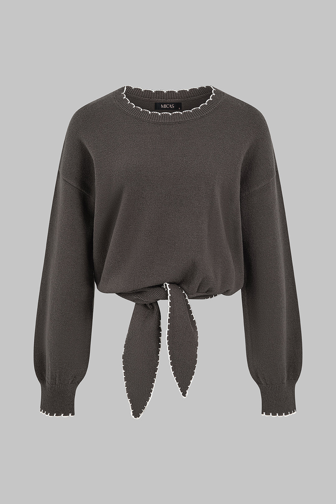 Gebreide patchwork top met knoopdetail en lange mouwen