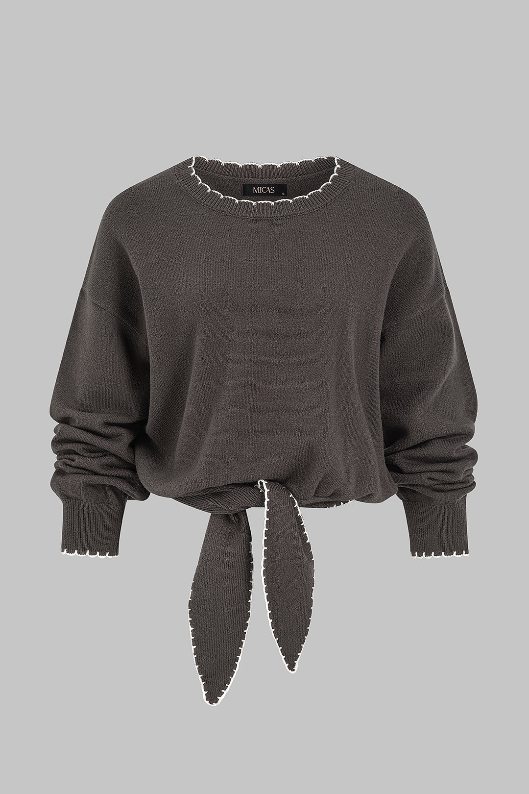 Gebreide patchwork top met knoopdetail en lange mouwen