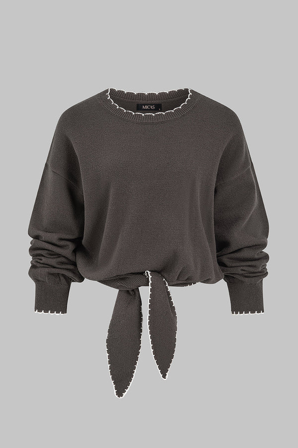 Gebreide patchwork top met knoopdetail en lange mouwen
