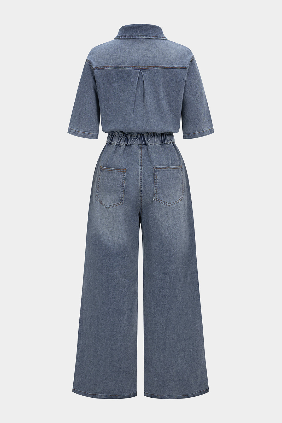 Denim jumpsuit met knoopjes, trekkoord en zakken