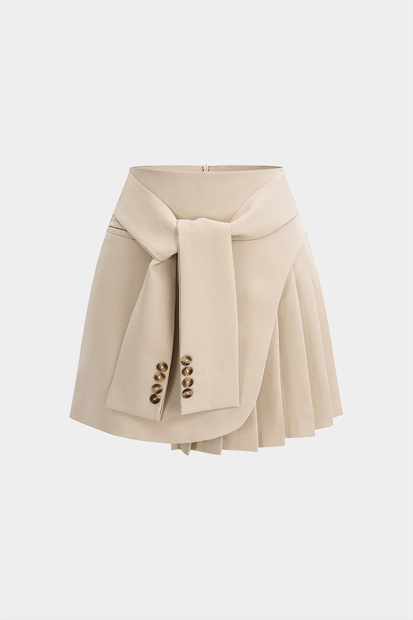 Asymmetrische geplooide rok met strik, hoge taille en A-lijn