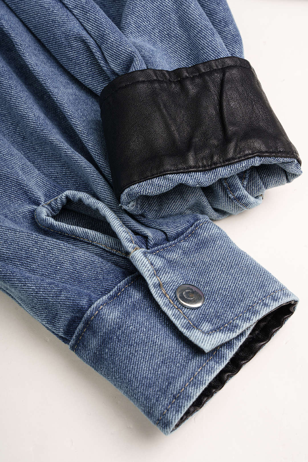 Denim patchwork jumpsuit met zakken en lange mouwen