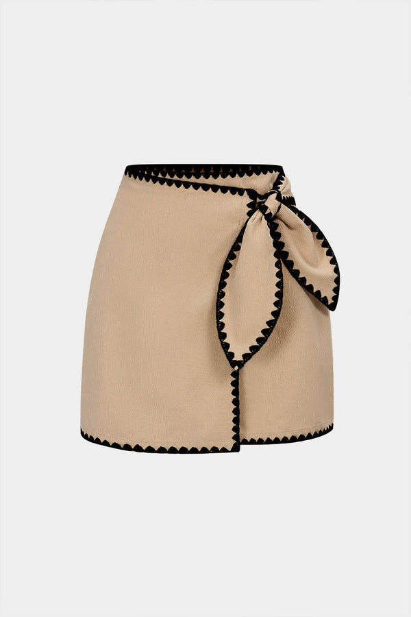 Asymmetrische rok met knoopdetail
