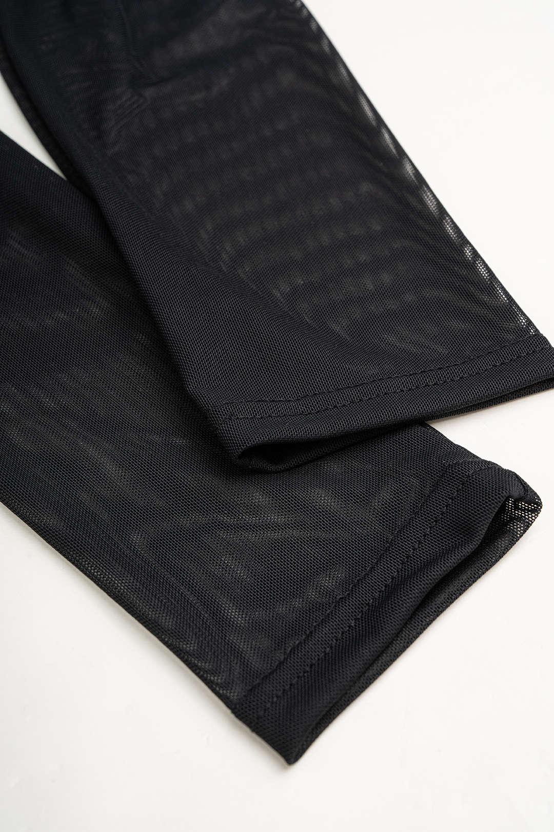 Mesh top met drapering, watervalhals en lange mouwen