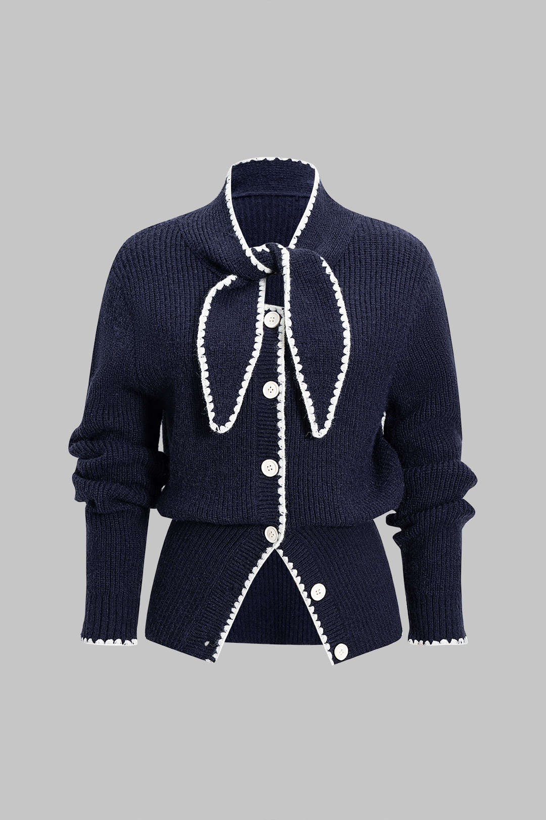 Gebreid vest met knoopjes en strik