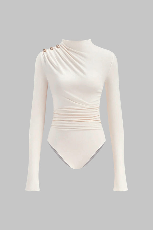 Asymmetrische body met knoopjes, ruches en lange mouwen