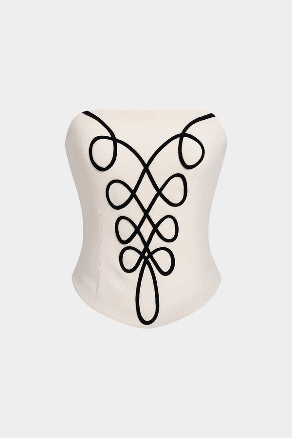 Strapless top met borduursel