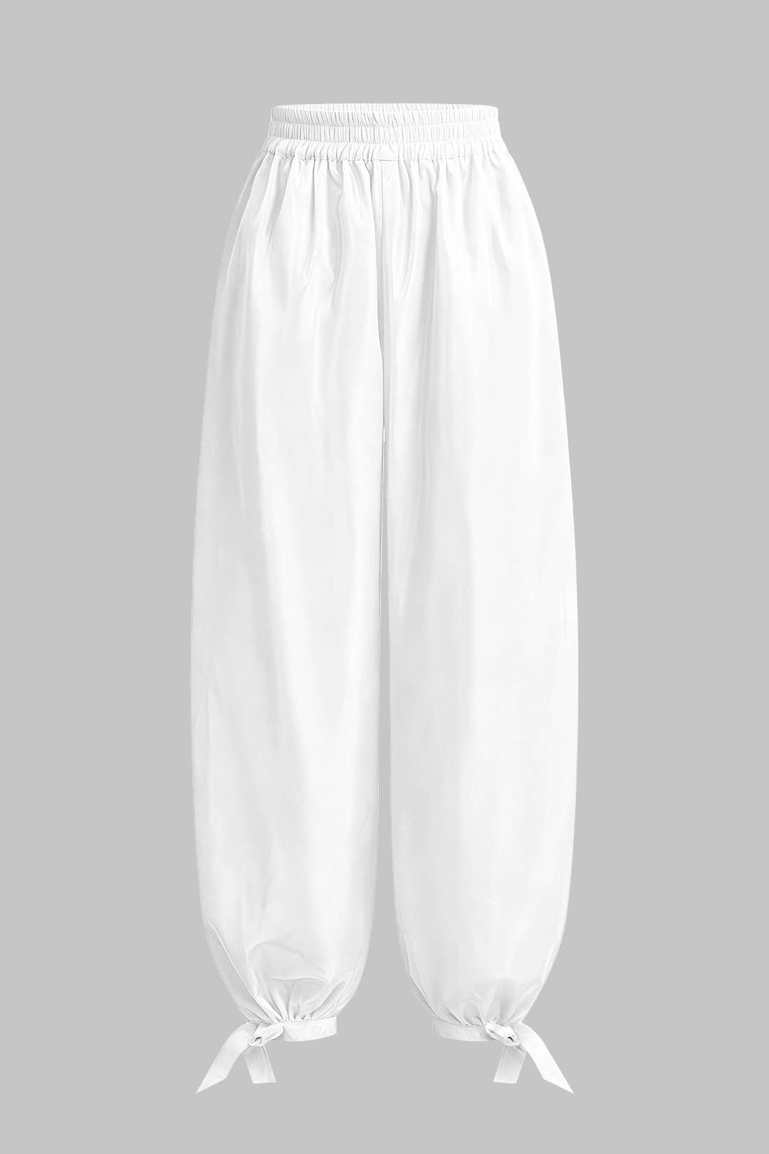 Broek met strik, smokwerk en wijde pijpen