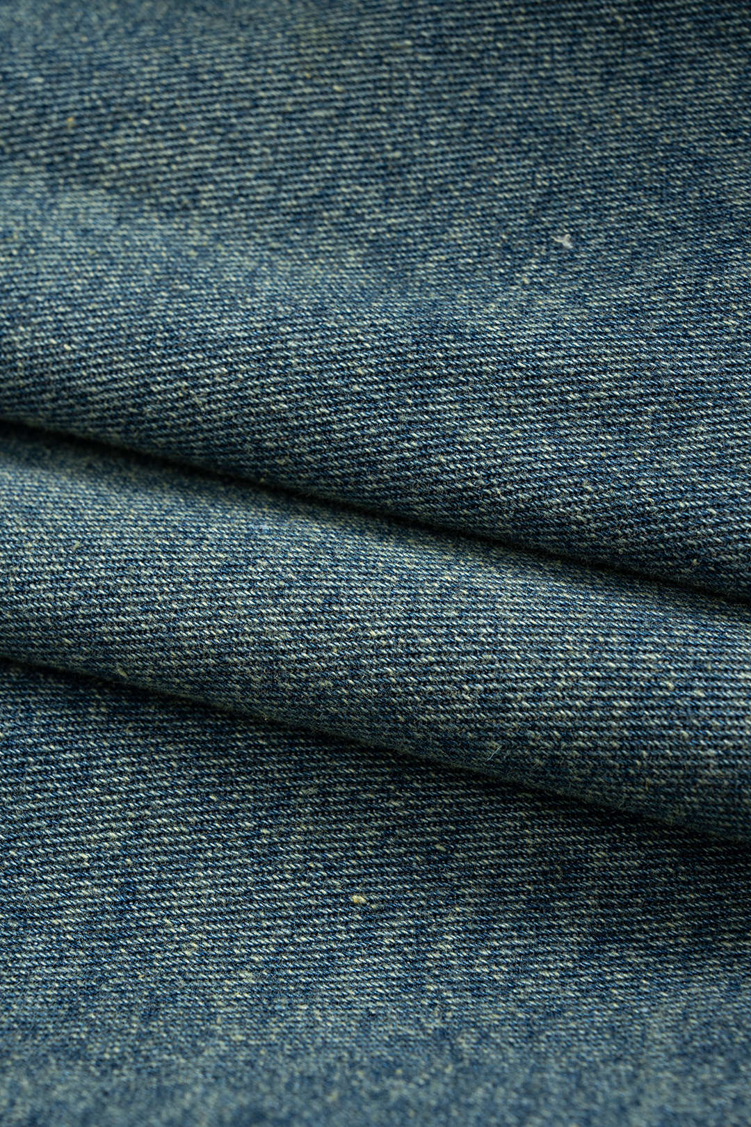 Denim patchwork item met knoopjes en zakken