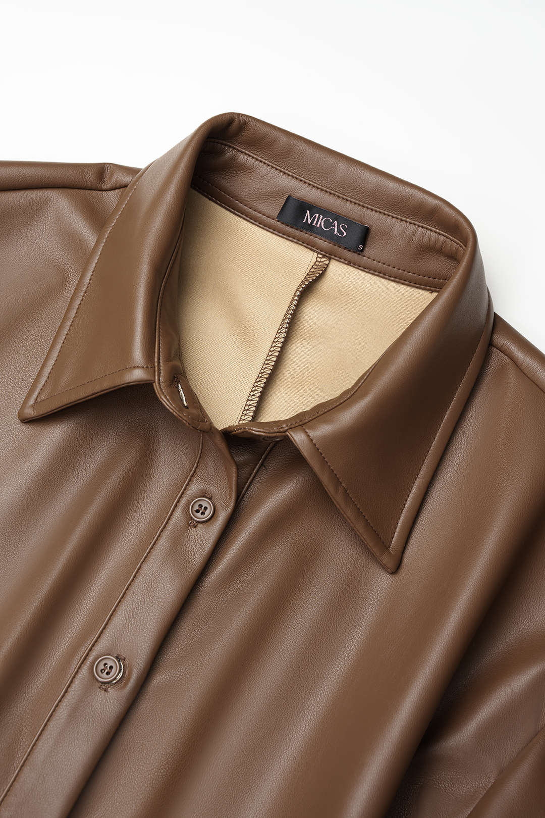 Leren-look metallic blouse met kettingdetail en lange mouwen