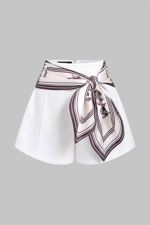 Geometrische short met strik en wijde pijpen