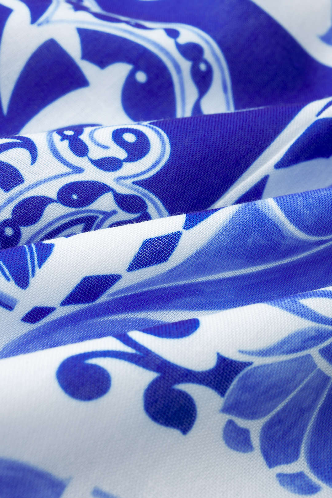 Bloemenprint mouwloze minijurk met ronde hals en knoopdetail