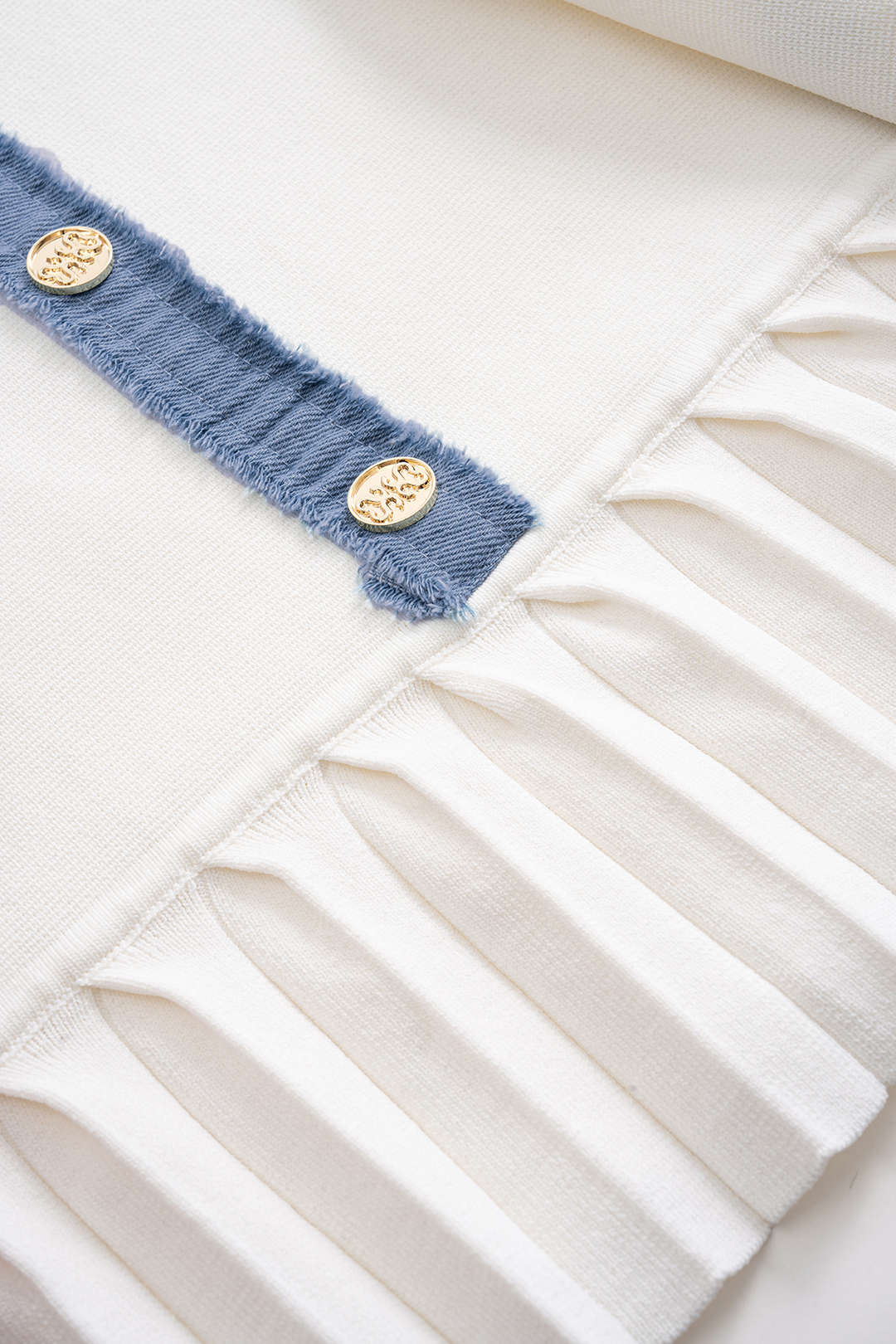 Gebreide patchwork minijurk met knoopjes