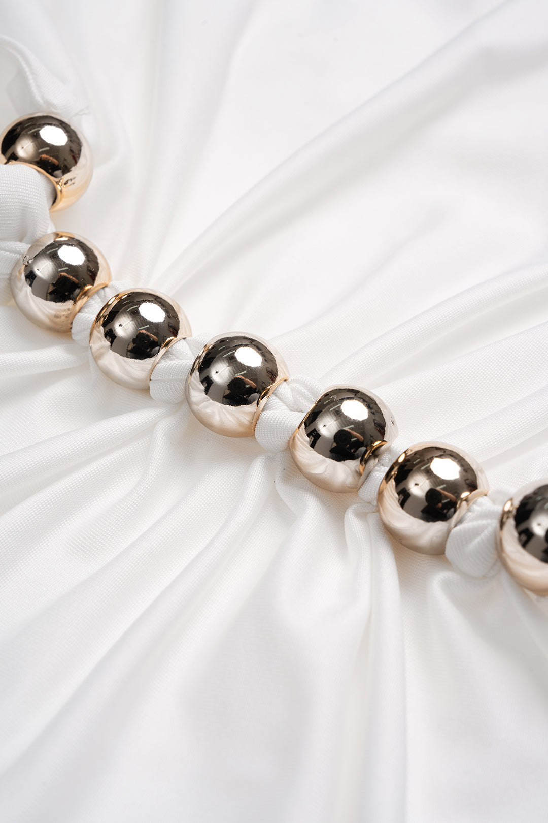 Metallic top met V-hals en ruches