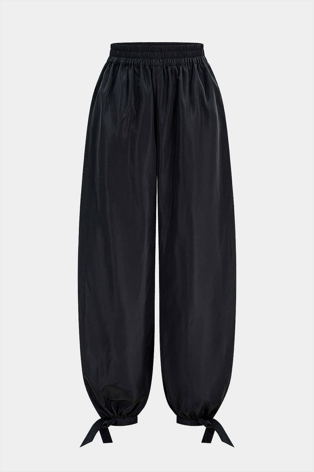 Broek met strik, smokwerk en wijde pijpen