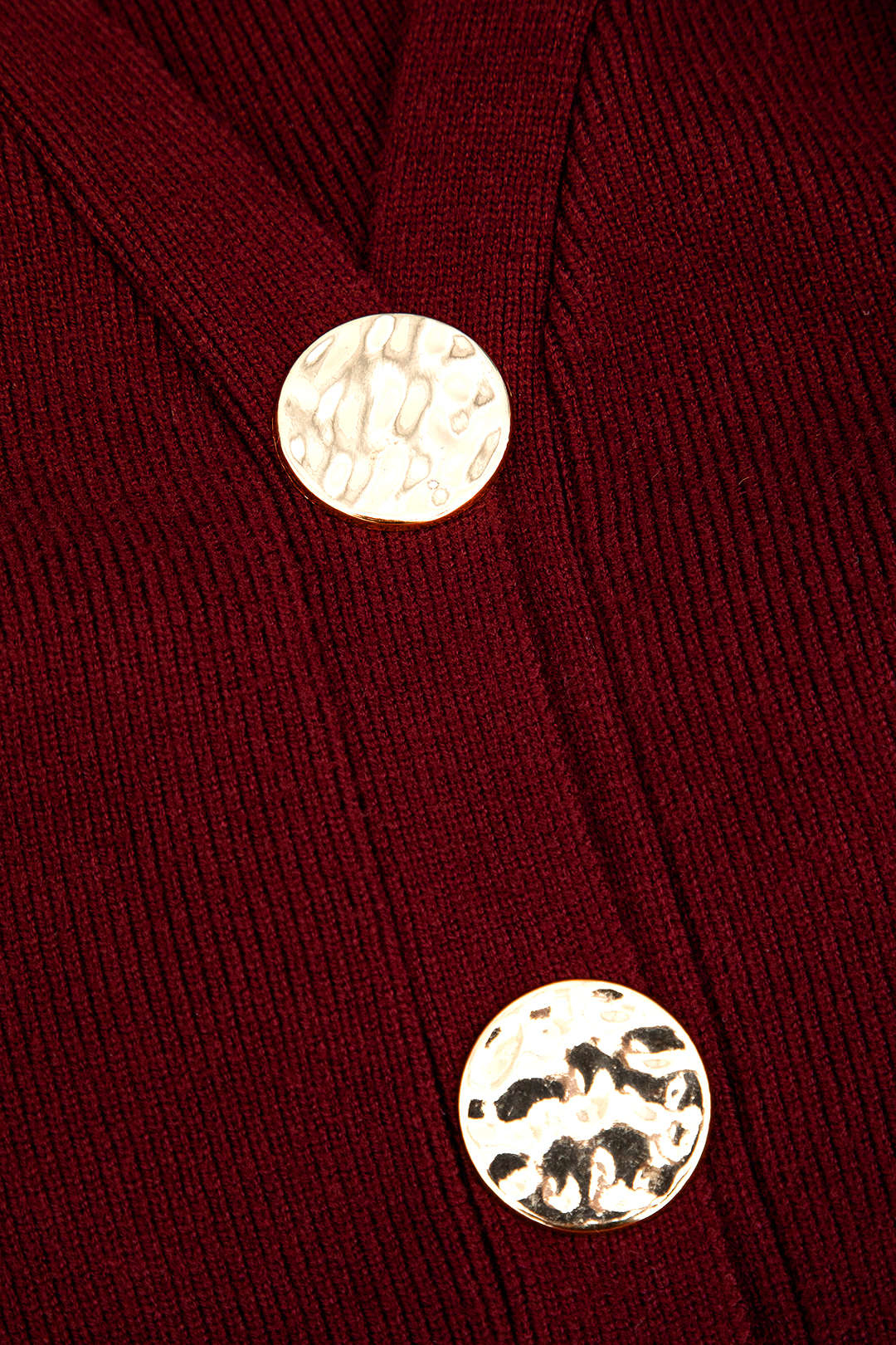Gebreid vest met knoopjes en V-hals