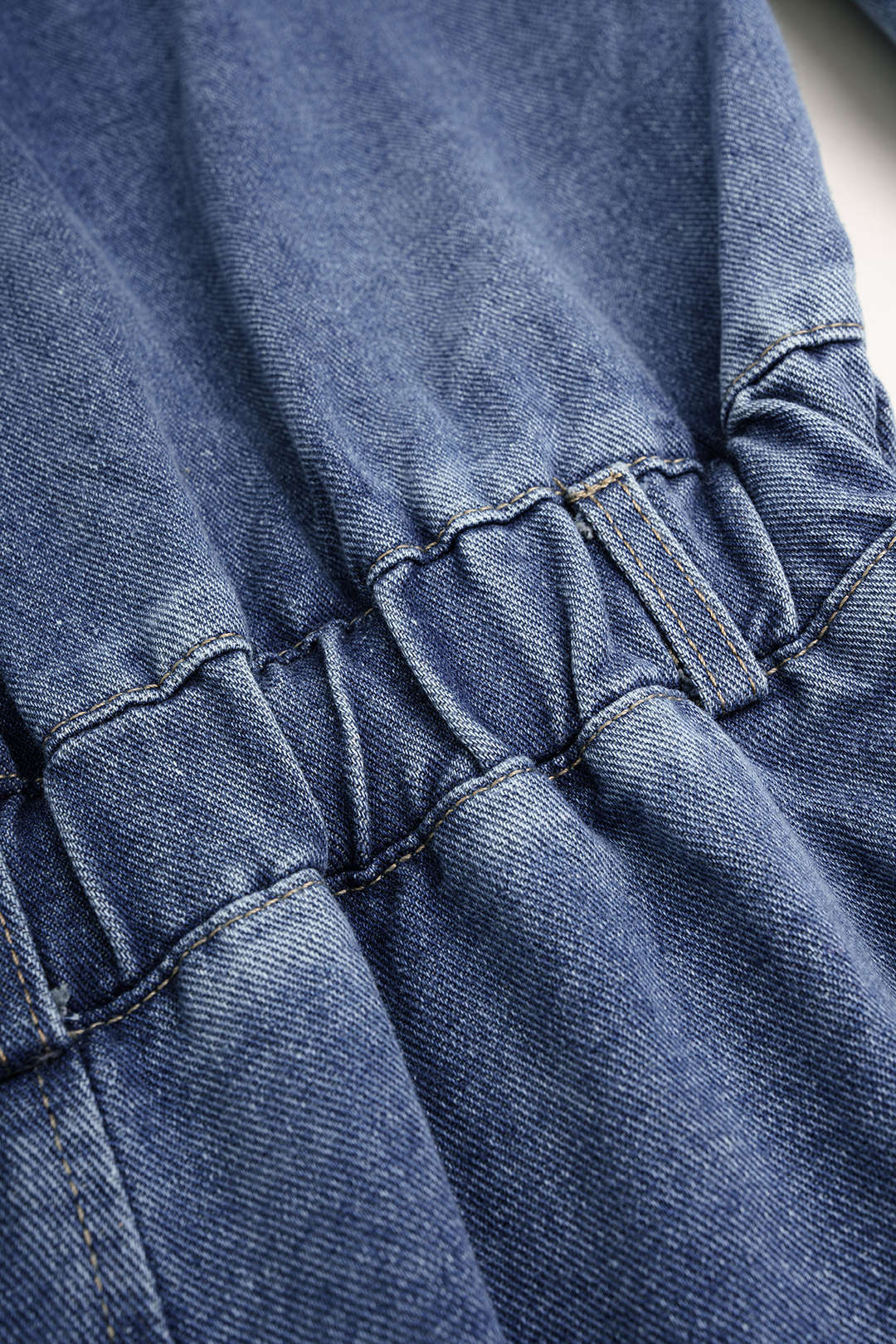 Denim patchwork jumpsuit met zakken en lange mouwen