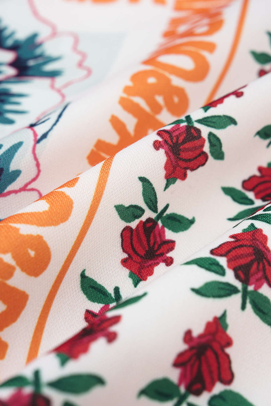 Bloemenprint minirok met knoopdetail en wikkelmodel