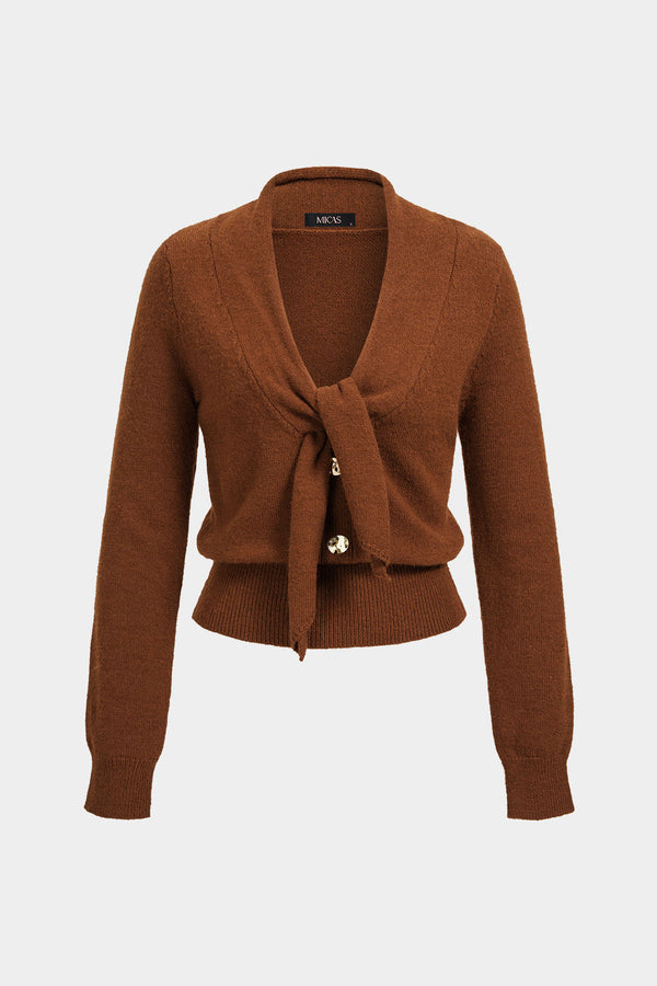 Gebreide metallic top met knoopjes en knoopdetail