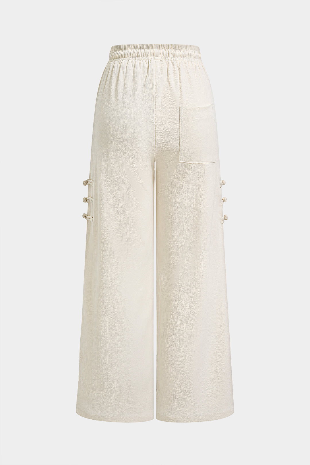 Broek met franjes, strik en zakken