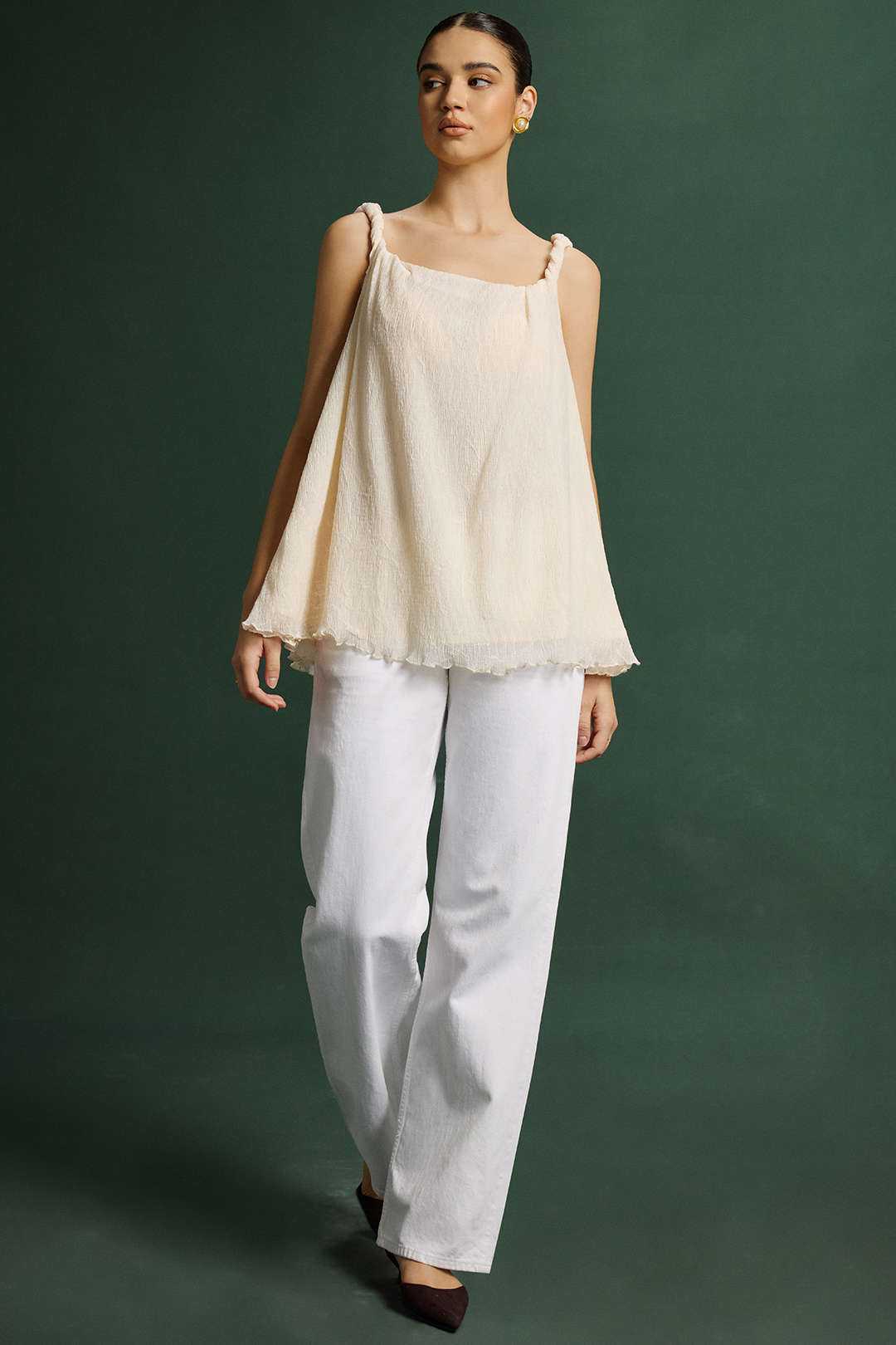 Top met gedraaid detail, knoopdetail en asymmetrische zoom