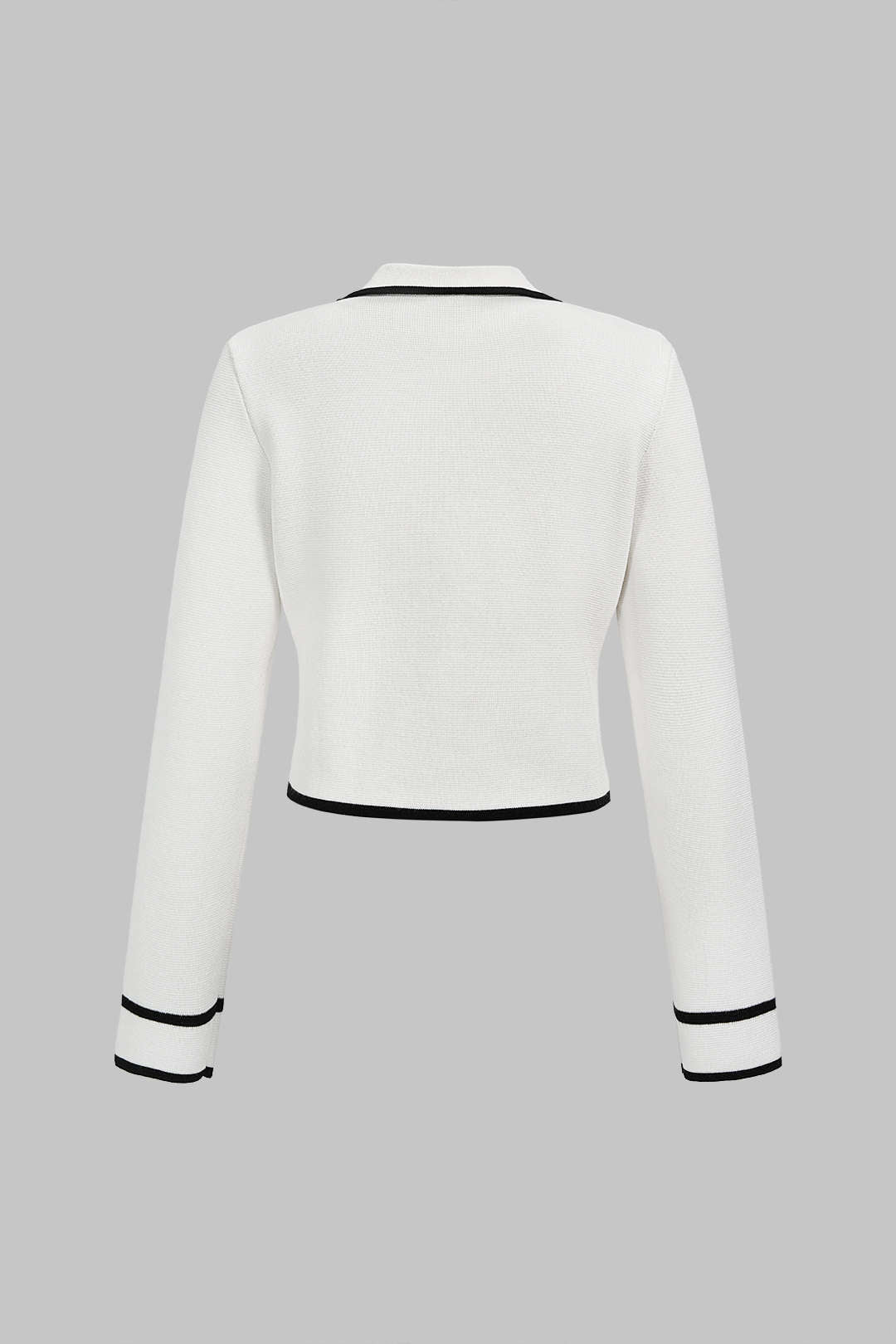 Gebreide metallic top met knoopjes en lange mouwen