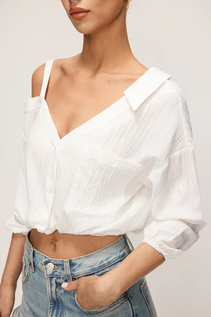 Asymmetrische, mouwloze blouse met knoopsluiting en open rug