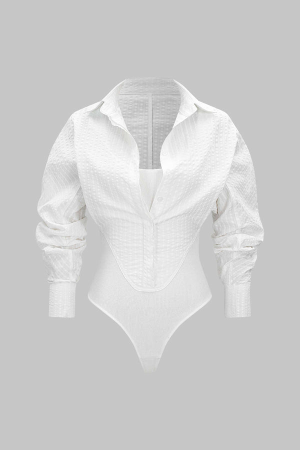 Body met knoopjes, uitsnijding en lange mouwen