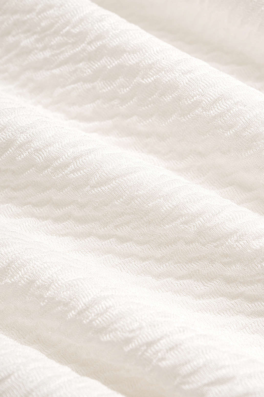 Mouwloze maxijurk met gedraaid detail en knoopdetail