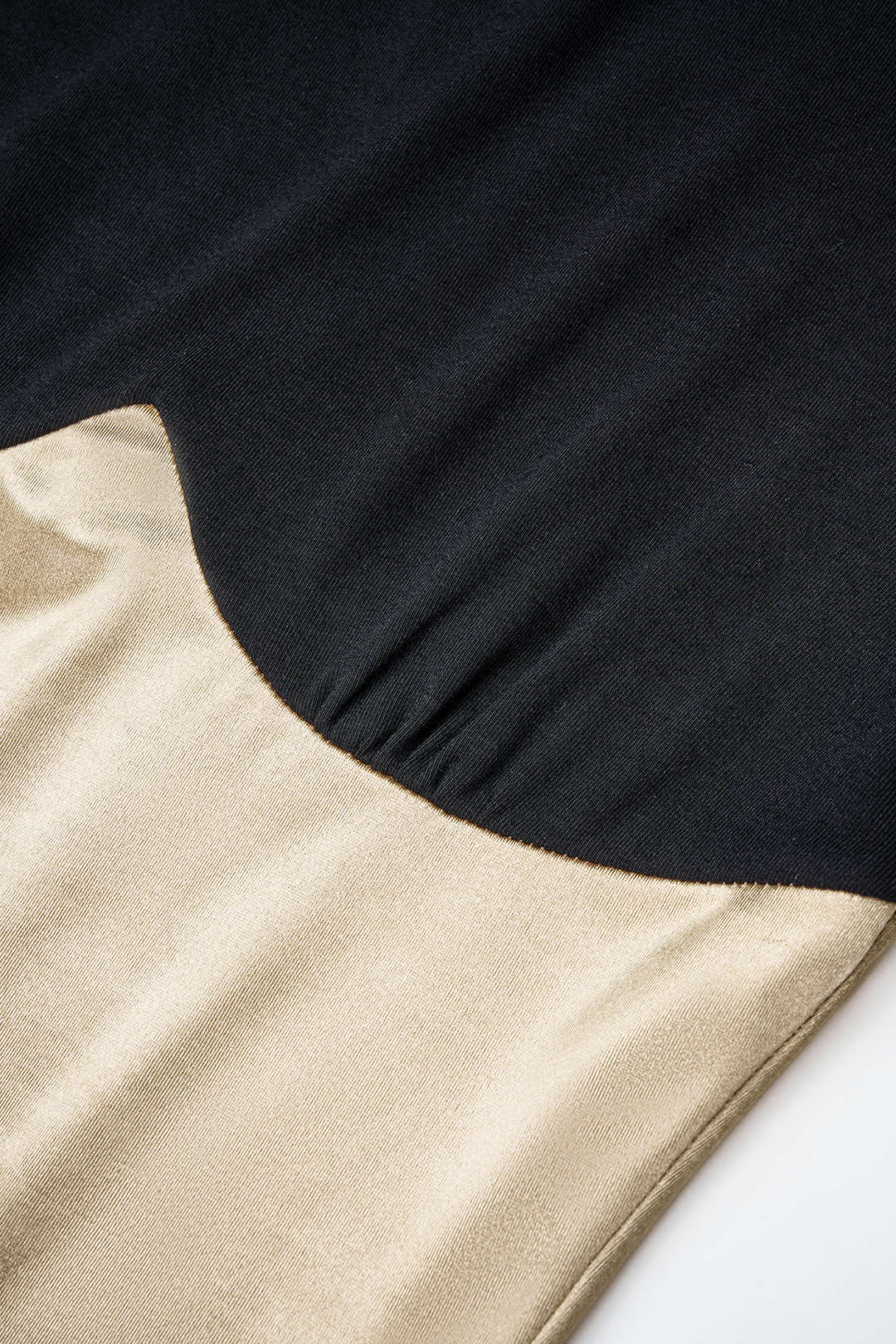 Patchwork body met rits en lange mouwen