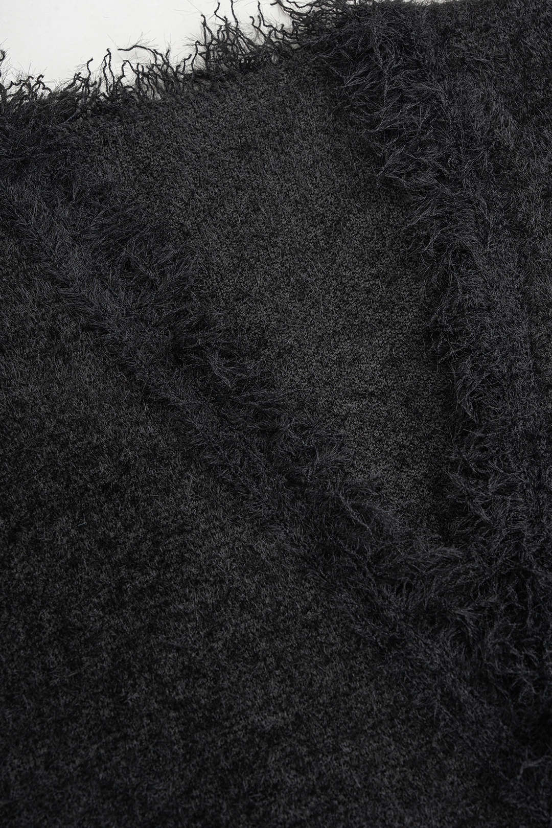 Gebreid gilet met V-hals en rafelrand