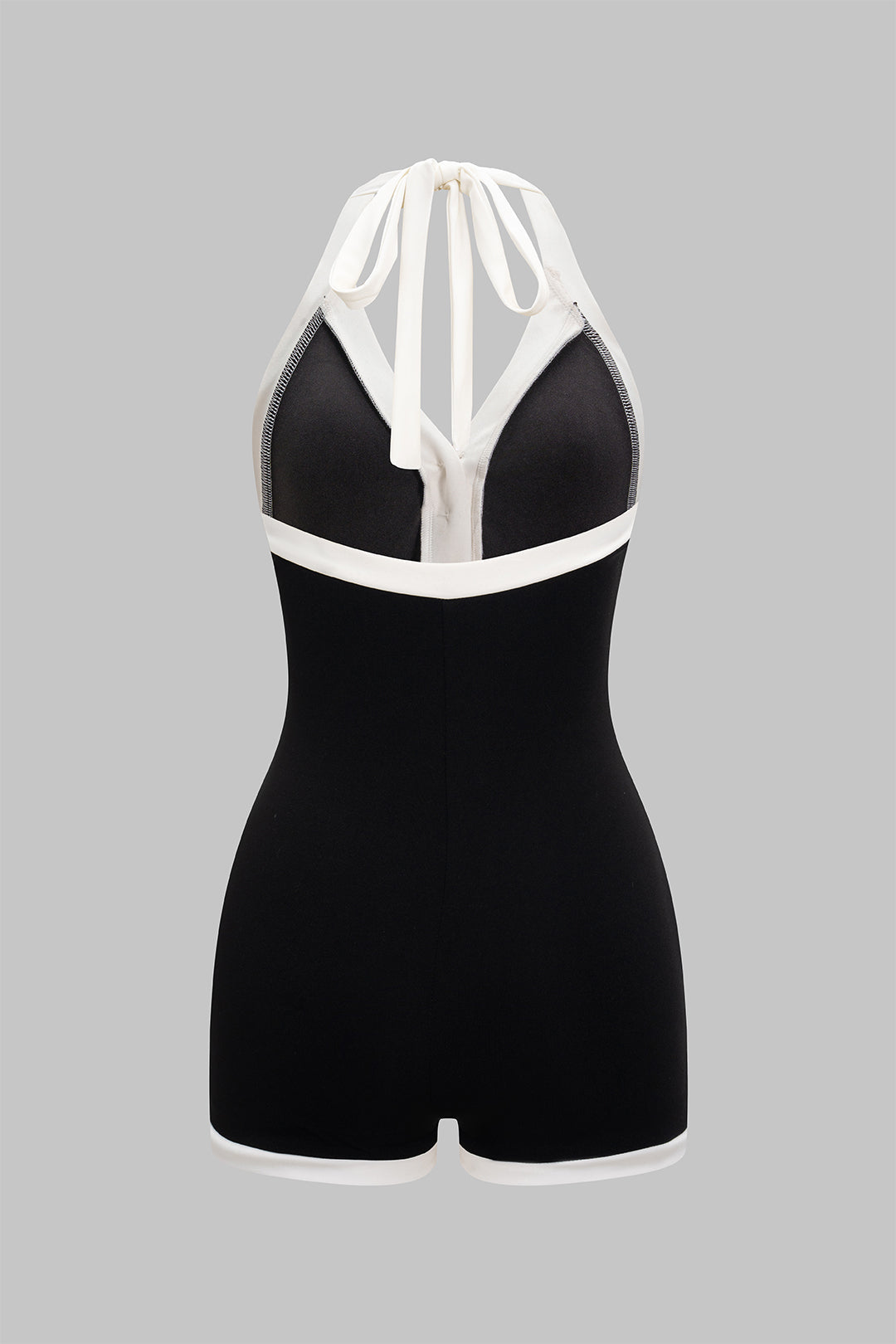 Mouwloze playsuit met halternek, open rug en strik