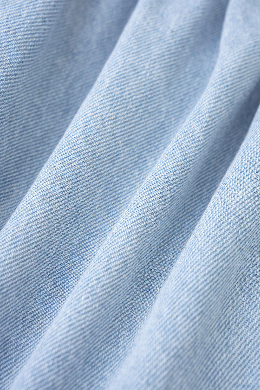 Denim mouwloze minijurk met revers, knoopjes en volants