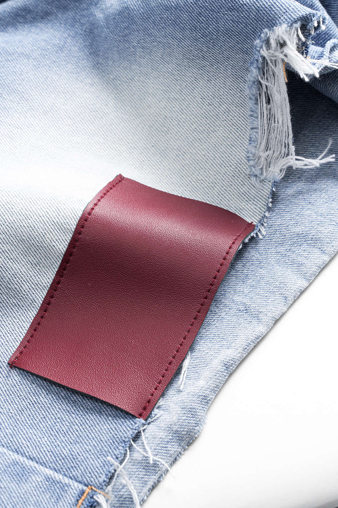 Denim asymmetrische short met knoopjes en zakken