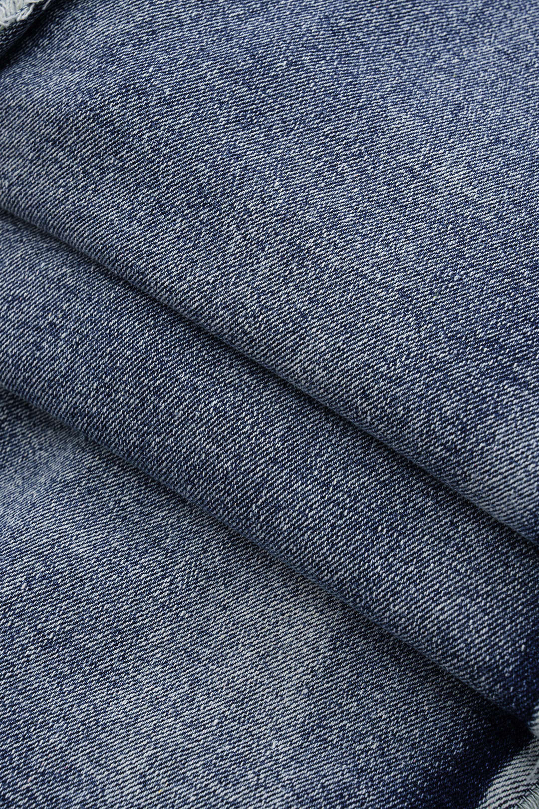 Asymmetrische denim minijurk met rafelrand