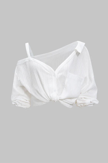 Asymmetrische, mouwloze blouse met knoopsluiting en open rug