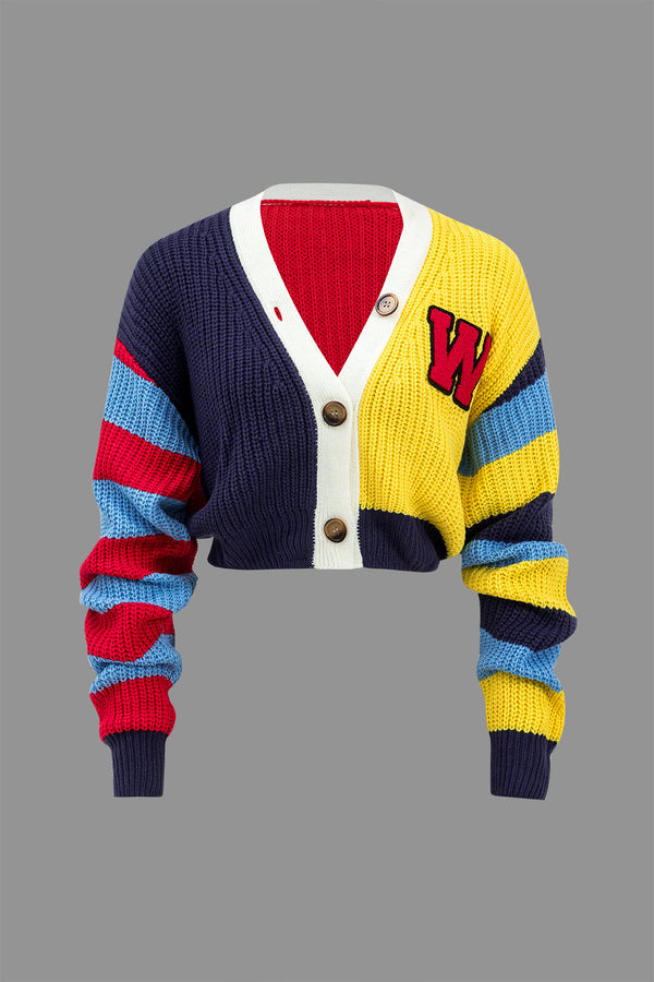Gebreid vest met knoopjes en lange mouwen