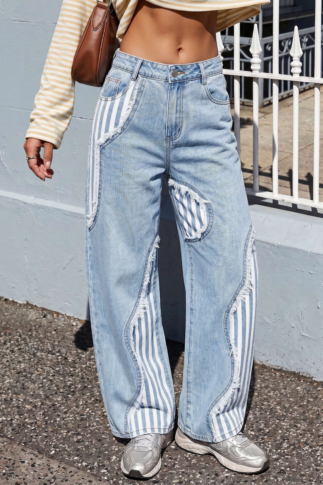 Patchwork jeans met rafelrand en wijde pijpen