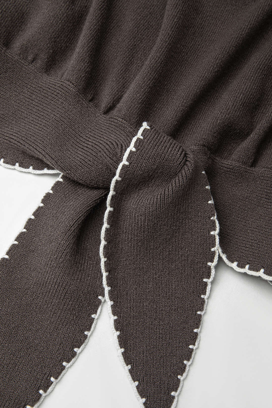 Gebreide patchwork top met knoopdetail en lange mouwen