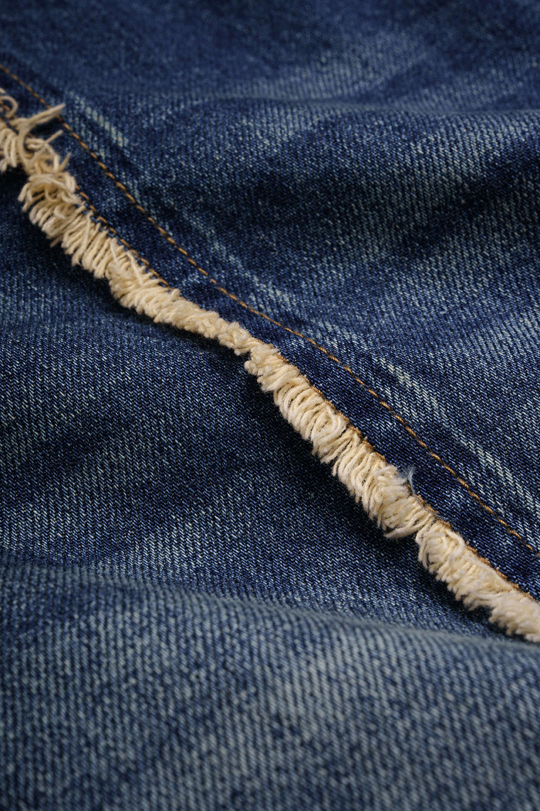 Asymmetrische jeans met franjes en zakken
