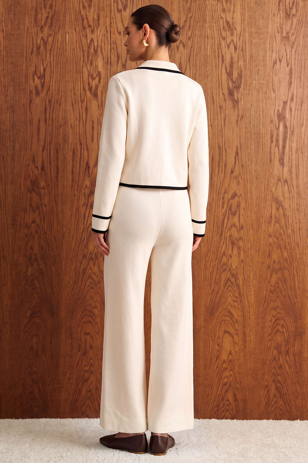 Gebreide metallic top met knoopjes en lange mouwen