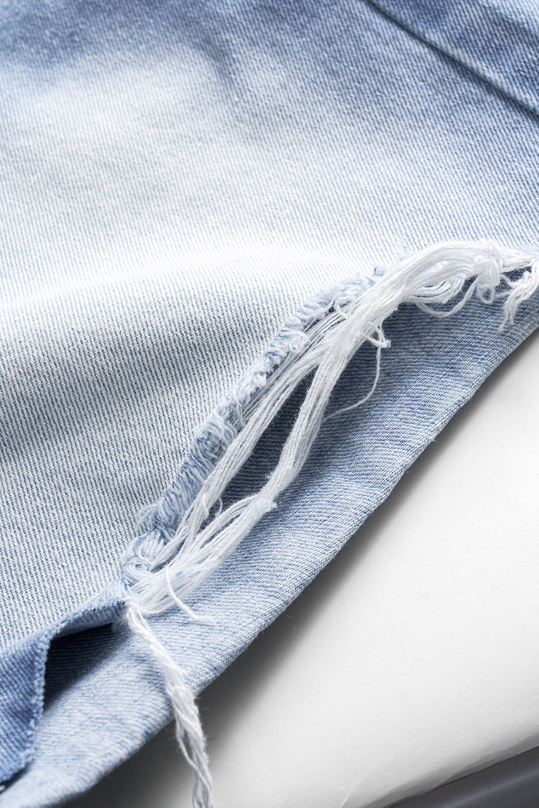 Denim asymmetrische short met knoopjes en zakken