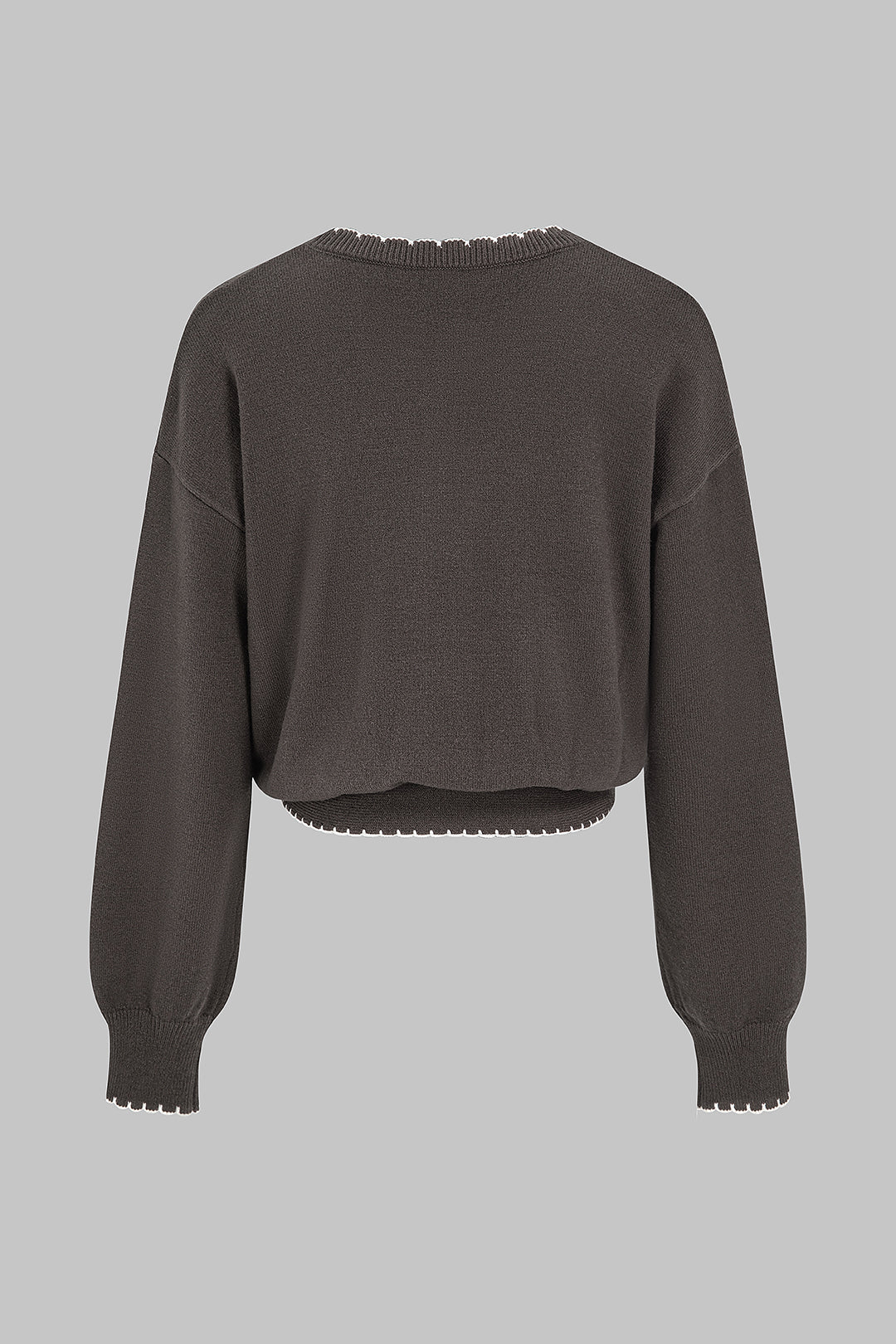 Gebreide patchwork top met knoopdetail en lange mouwen
