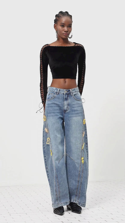 Denim jeans met metallic details en wijde pijpen